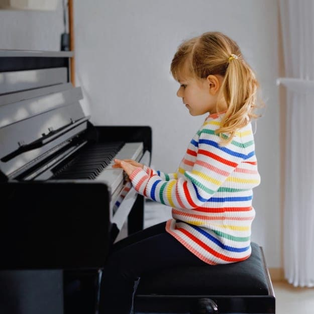 Child playing piano